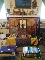 Rawhide spirit drums hanging at our altar.